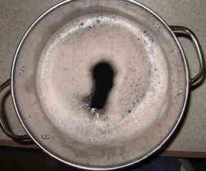 Dark liquid after potato starch has settled out